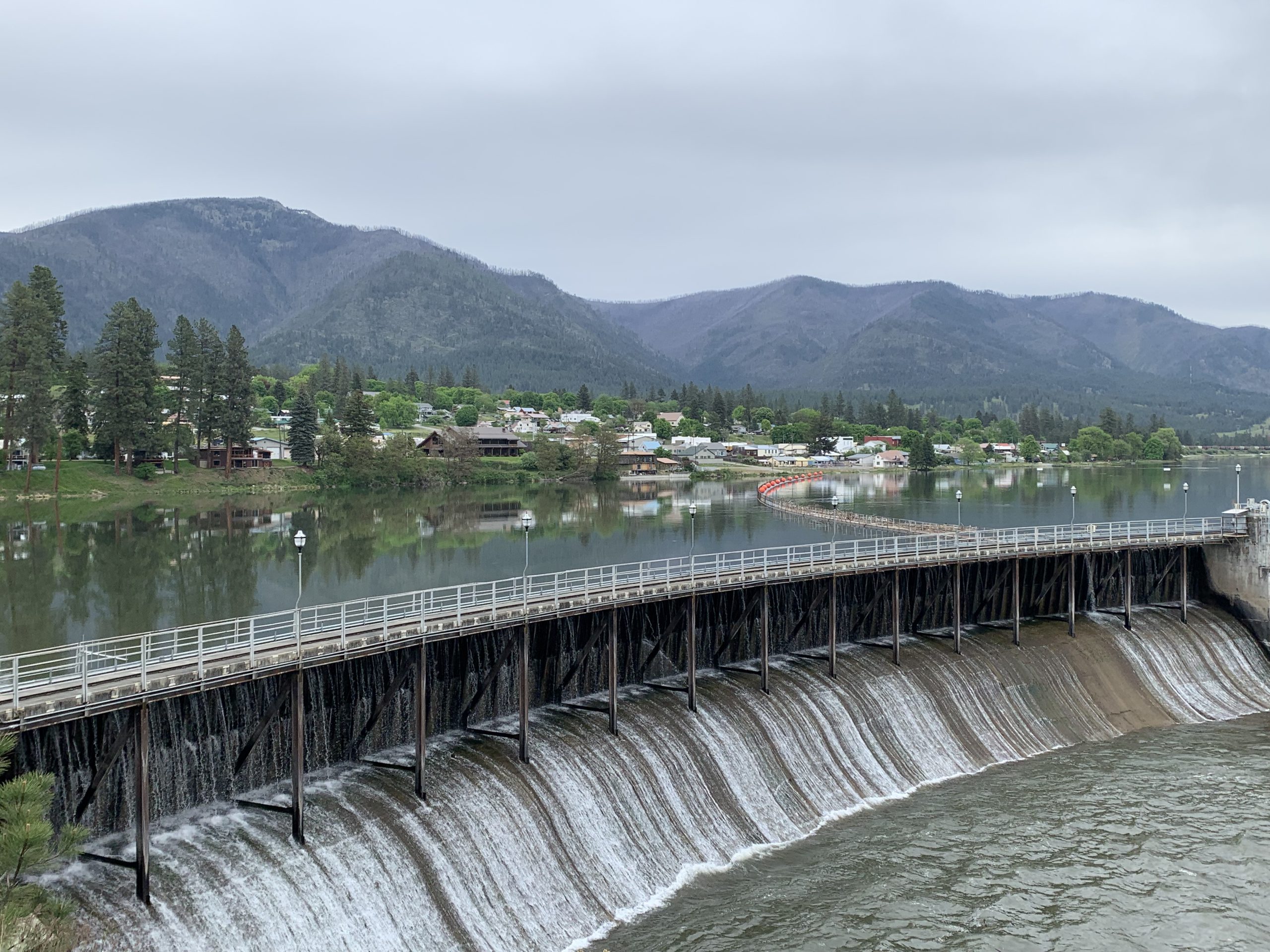 Thompson Falls dam on the Clark Fork River with the town and mountains beyond